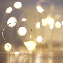 Load image into Gallery viewer, Close up of gold string lights 

