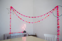 Load image into Gallery viewer, In this picture two garlands have been strung decoratively, diagonally across a room from wall to wall.  There is a table and chairs in the foreground.