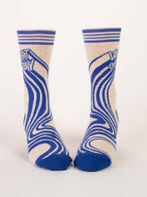 Load image into Gallery viewer, What a Guy Men’s crew Socks by Blue Q | £11.95. Ethical and sustainable socks with quirky, humorous designs and vibrant colours.  This design is in white and blue with an abstract swirl pattern emerging from the words “What a guy”. 
