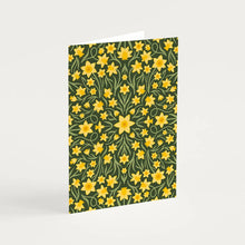 Load image into Gallery viewer, A greetings card with a design incorporating a symmetrical design of little yellow daffodils on a dark background