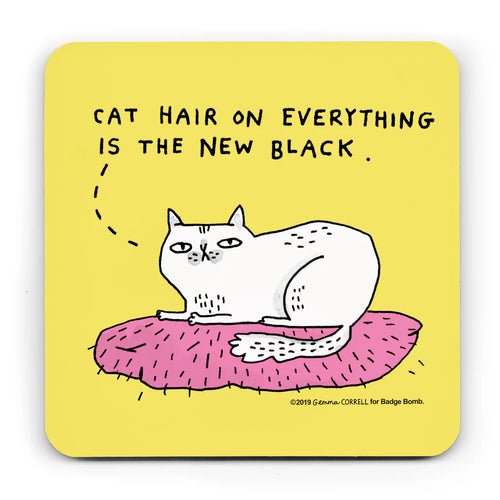 A yellow square coaster with an illustration by Gemma Correll of a white cat sitting on a pink cushion.   A dotted line form the cat's head goes to the words above 