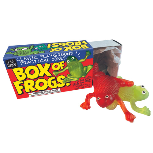 2 sticky frogs can be seen coming out of their brightly coloured, comic like,  cardboard box.  One frog is red, the other green.  The box says “ BOX OF FROGS”