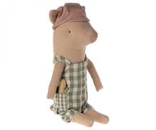 Load image into Gallery viewer, Soft toy pig wearing a striped red and cream cap with his ears sticking out through slits, and wearing green and white gingham overalls.  He has a toy baguette sticking out of his pocket
