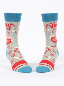 Video Game Men’s crew Socks by Blue Q | £11.95. Ethical and sustainable socks with quirky, humorous designs and vibrant colours. This design features a small man playing videogames on a tv with the words “Video game socks, game on, and on, and on, and on” above. 