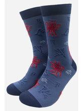 Load image into Gallery viewer, Blue sock with red octopus and squid all over print. Navy detail on cuff, heel and toes 
