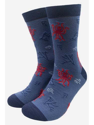 Blue sock with red octopus and squid all over print. Navy detail on cuff, heel and toes 