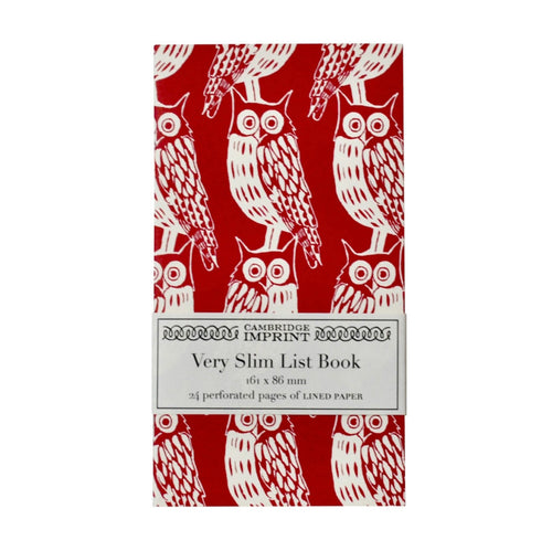 This slim notebook has a dark red background with repeating pattern of owls.  In this picture it has a paer wrap around label with Cambridge Imprint's logo and the wording 