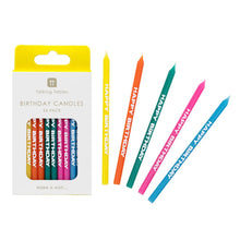 Load image into Gallery viewer, cake candles can be seen in their box and also out of their packaging, so that the lettering HAPPY BIRTHDAY can be seen running down each candle.  The candles are a rinbow mix, including yellow, orange, green, pink and blue