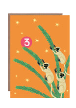 Load image into Gallery viewer, Brightly coloured 3rd birthday card featuring 3 lemurs climbing in a monkey puzzle tree
