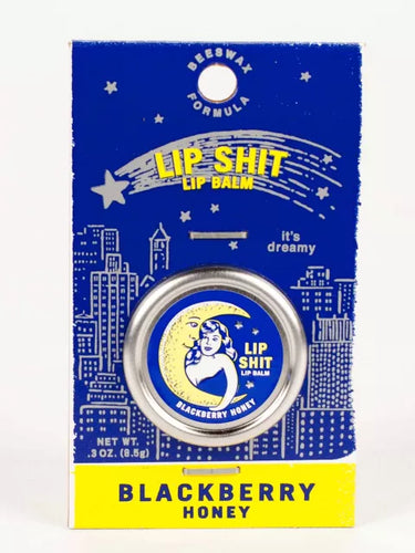 Blackberry & Honey Lip S**t by Blue Q | £7.50. All natural, vitamin E fortified lip balm. The lip balm is contained within a round metal tin with a sticker on the front depicting the moon and a woman hugging with the words “Lip Shit” above. 
