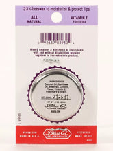 Load image into Gallery viewer, Strawberry and Cream Lip S**t by Blue Q | £7.50. All natural, vitamin E fortified lip balm. The lip balm is contained within a round metal tin with a sticker on the front depicting a cute little zebra.