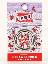 Load image into Gallery viewer, Strawberry and Cream Lip S**t by Blue Q | £7.50. All natural, vitamin E fortified lip balm. The lip balm is contained within a round metal tin with a sticker on the front depicting a cute little zebra.