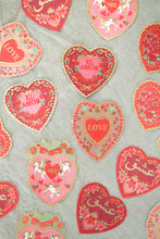 Load image into Gallery viewer, Beautifully screen printed hearts, in red, pink and gold, with the words love in different languages