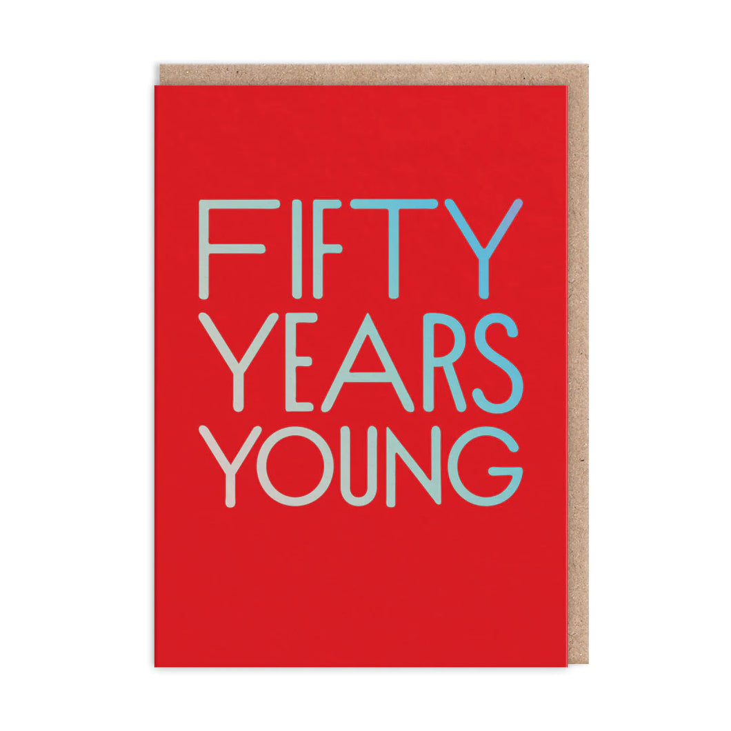 Bright red card with holographic large capital letters “FIFTY YEARS YOUNG”.  The kraft envelope is visible behind