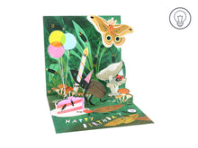Load image into Gallery viewer, The open 3D card with a butterfly in a birthday hat flying, a beetle in a party hat placing a candle on a cake, a ladybird in a hat and little ants scurrying about.
