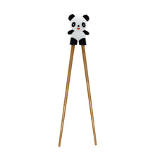 Load image into Gallery viewer, A pair of wooden chopsticks with a cute black and white panda figure on the tips, shown against a plain white background.