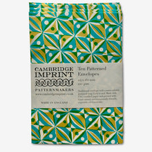Load image into Gallery viewer, ten patterned envelopes with a paper belly band with the Cambridge Imprint Logo and product information.  The pattern is a block print of repeating squares with dots and triangles within them in turquoise and yellow

