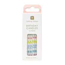 Load image into Gallery viewer, cake candles in their white cardboard packaging.  A cut out window allows you to see the little white cake candles with pastel coloured flowers in purple, blues, pink and yellow running up their length.
