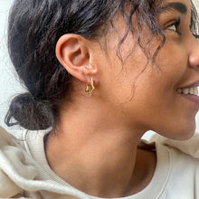 Load image into Gallery viewer, Gold Star Hoop Earrings by Lisa Angel | £18.00. These hoop star-shaped earrings are wonderful for adding a golden finishing touch to your look. Made from 18ct gold plated brass , these earrings open by pulling them gently apart at the top, opening them via the hinge at the bottom to reveal the 18ct gold sterling silver posts.
