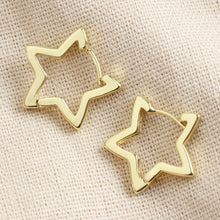 Load image into Gallery viewer, Gold Star Hoop Earrings by Lisa Angel | £18.00. These hoop star-shaped earrings are wonderful for adding a golden finishing touch to your look. Made from 18ct gold plated brass , these earrings open by pulling them gently apart at the top, opening them via the hinge at the bottom to reveal the 18ct gold sterling silver posts.