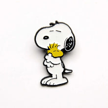 Load image into Gallery viewer, The pin is of snoopy hugging woodstock
