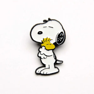 The pin is of snoopy hugging woodstock