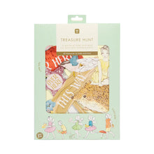 Load image into Gallery viewer, The fairy tresure hunt game is seen in its flat cardboard, plastic free, packaging.  The box is pale green and is decorated with fairies.  In the centre there is an illustration  of  what you could see if there was a cut out window in the box; a rangle of the pieces including a fairy on a hedgehog, and signs on little cardboard cutouts saying "over Here" and "This Way".