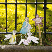 Load image into Gallery viewer, some of the cut out picture props: 3 little fairies and a sparkly wand that says "Over Here"