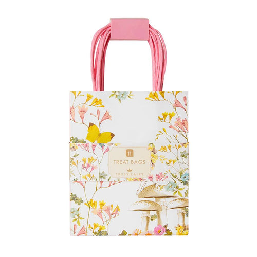 A pack og 8 fairy illustrated paper treat bags.  the bags are white with delicate illustrations of flowers and butterflies in yellow, pink and blue.  A fairy is sitting on a mushroom