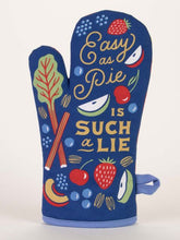Load image into Gallery viewer, Nevy blue oven glove with the Words Easy as Pie in an elegant scroll font and then in bigger capital letters IS SUCH A LIE.  The text is surrounded by illustrations of various fruit and vegetables, including strawberries, apples and a leafy green.