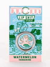 Load image into Gallery viewer, Watermelon & Tangerine Lip S**t by Blue Q | £7.50. All natural, vitamin E fortified lip balm. The lip balm is contained within a round metal tin with a sticker on the front depicting a pink octopus sipping from a cup using a straw with the words “Lip Shit” above.
