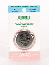 Load image into Gallery viewer, Watermelon & Tangerine Lip S**t by Blue Q | £7.50. All natural, vitamin E fortified lip balm. The lip balm is contained within a round metal tin with a sticker on the front depicting a pink octopus sipping from a cup using a straw with the words “Lip Shit” above.