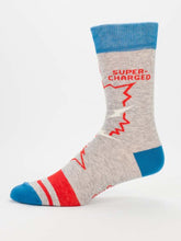 Load image into Gallery viewer, Video Game Men’s crew Socks by Blue Q | £11.95. Ethical and sustainable socks with quirky, humorous designs and vibrant colours. This design features a small man playing videogames on a tv with the words “Video game socks, game on, and on, and on, and on” above. 
