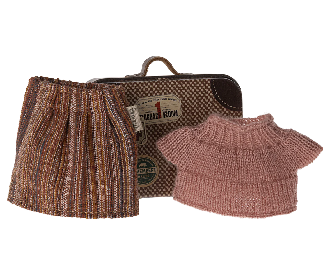 Beautiful pink knitted jumper and brown pleated striped skirt to fit Grandma Mouse.  Behind the clothing can be see the little tin suitcase in the style of a vintage case with stickers of destinations