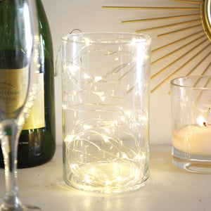 Silver battery powered lights in glass vase