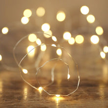 Load image into Gallery viewer, Close up of battery powered silver string lights

