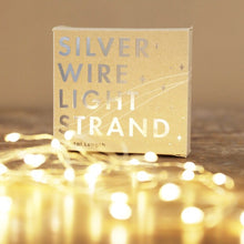 Load image into Gallery viewer, Silver battery operated string lights in front of it&#39;s box packaging 
