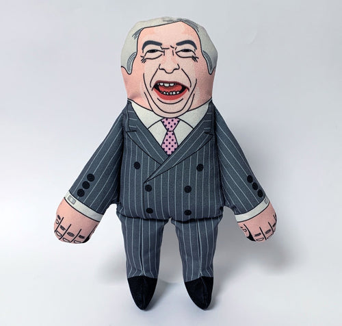 Nigel Farage squeaking Dog Toy by pet hates, wearing a grey double breasted pin stripe suiit and his face is printed, with characteristic wide mouth self satisfied smile.