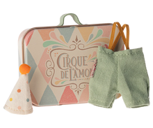 Load image into Gallery viewer, little metal suitcase with harlequin design in pastel colours and the words &quot;Cirque De L&#39;Amour&quot;.  The tiny clothes are little pale turquoise trousers brown elastic braces and a spotty pointed hat with a little orange pom pom on top.
