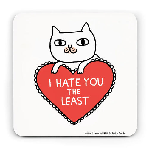 White coaster with an illustration by Gemma Correll of a cat leaning on a frilly heart shaped cusion which reads 