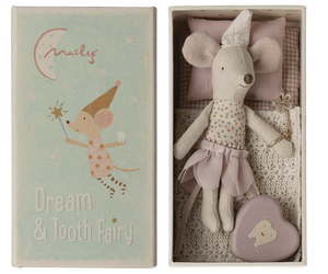 Maileg's tooth fairy, wearing a little  soft pointed cap and holding a sparkly wand.  She is wearing a layered  pink petal shaped skirt and has a fixed spotty top.  She has a gingham covered mattress and beautiful crochet look soft cream blanket.  Inside the box is also a little enamel heart shape tin with a smiling tooth on it.  The top of the box  has an illustration of a tooth fairy mouse holding her wand and carrying a tooth.  Below are the words "Dream & Tooth Fairy