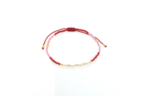 Beaded bracelet with pink, red and gold glass beads and 4 freshwater pearls