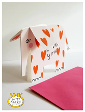 Load image into Gallery viewer, cut out shaped card of  an elephant with sticking out 3D ears.  \The elephant is white with red hearts all over and cute pink cheeks
