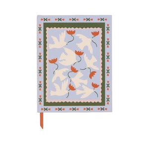 pale blue notebook with a desgn featuring 7 white doves with red flowers in their beaks.  Aound them is a border pattern of red flowers.