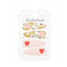 Load image into Gallery viewer, 4 hair clips, 2 of which are covered in a floral print fabric with a pink heart and the other two ina pale pink fabric with a red heart.
