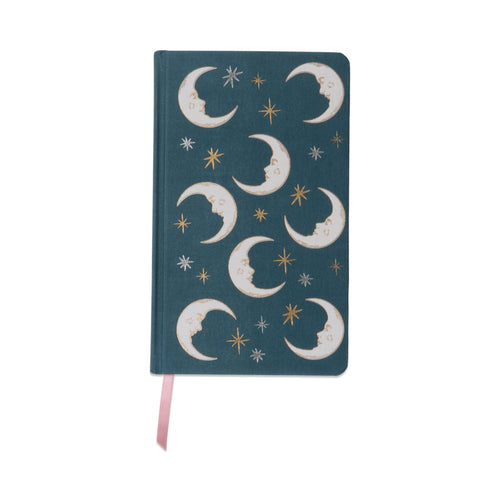 Notebook with moon and star design on a teal background