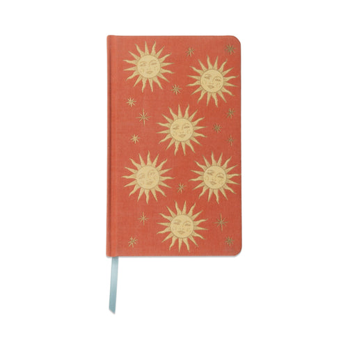 Red notebook with gold sun designs 