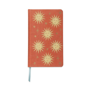 Red notebook with gold sun designs 