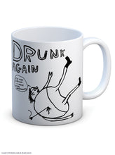 Load image into Gallery viewer, David Shrigley Boxed Mug - Drunk Again | £10.00. White ceramic mug with artwork by David Shrigley. The words &quot;drunk again&quot; appear above a line drawing of a rotund figure with skinny legs lying on the ground with their legs up in the air. The figure has an arrow sticking into his back. A speech bubble reads &quot;I&#39;m not drunk. I have been Harpooned&quot;
