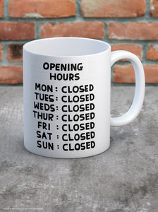 David Shrigley Boxed Mug – Opening Hours | £10.00. White ceramic mug with David Shrigley drawing depicting opening hours of a company. Every day of the week is closed. The perfect gift for fans of humorous, quirky illustration, or for those who work in a shop, or in hospitality. 